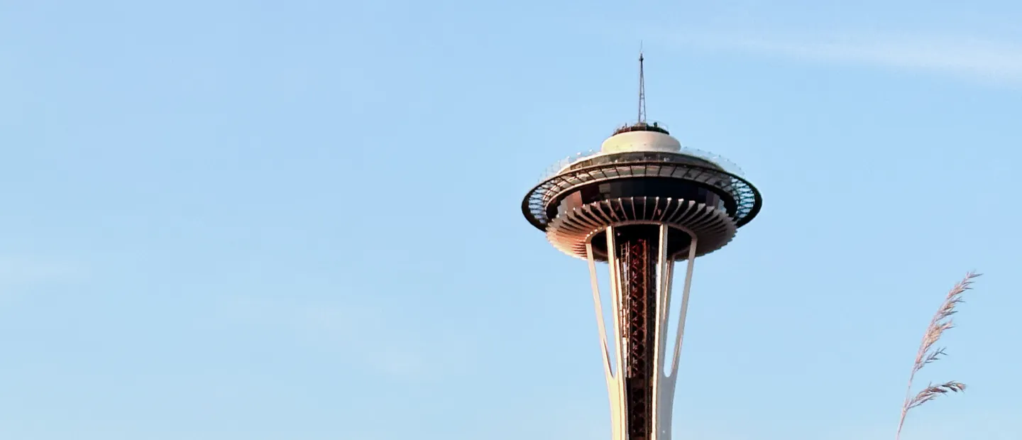 space needle and pacific science center with flowers