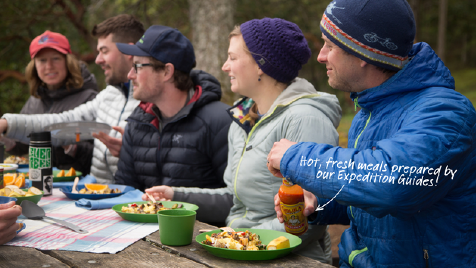 People enjoying a meal at the campsites